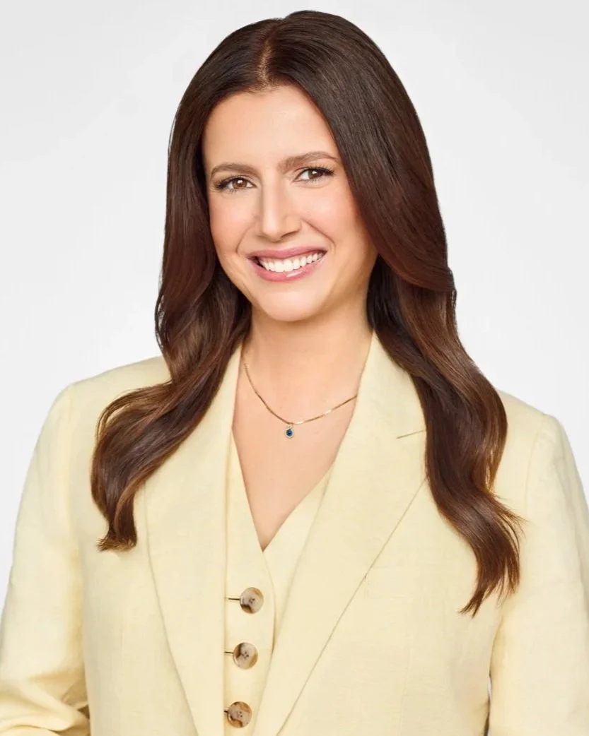 A professional personal branding headshot of a woman in a yellow blazer for her LinkedIn profile and business website.