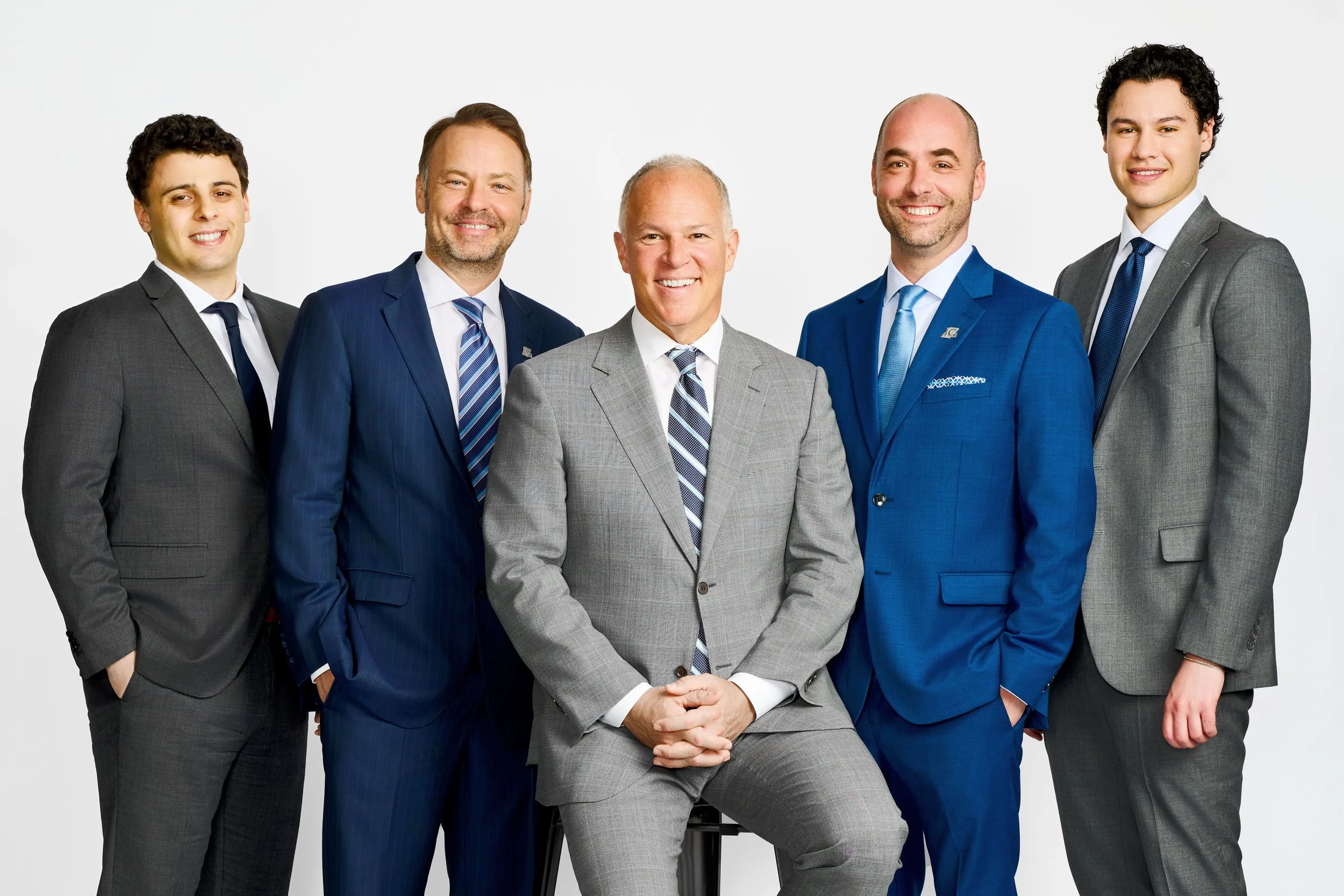 A professional group of men in suits during a corporate team headshot session in Toronto.