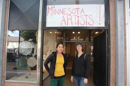 Lela Pierce & Sarita Zaleha pictured next to artwork by Zaleha