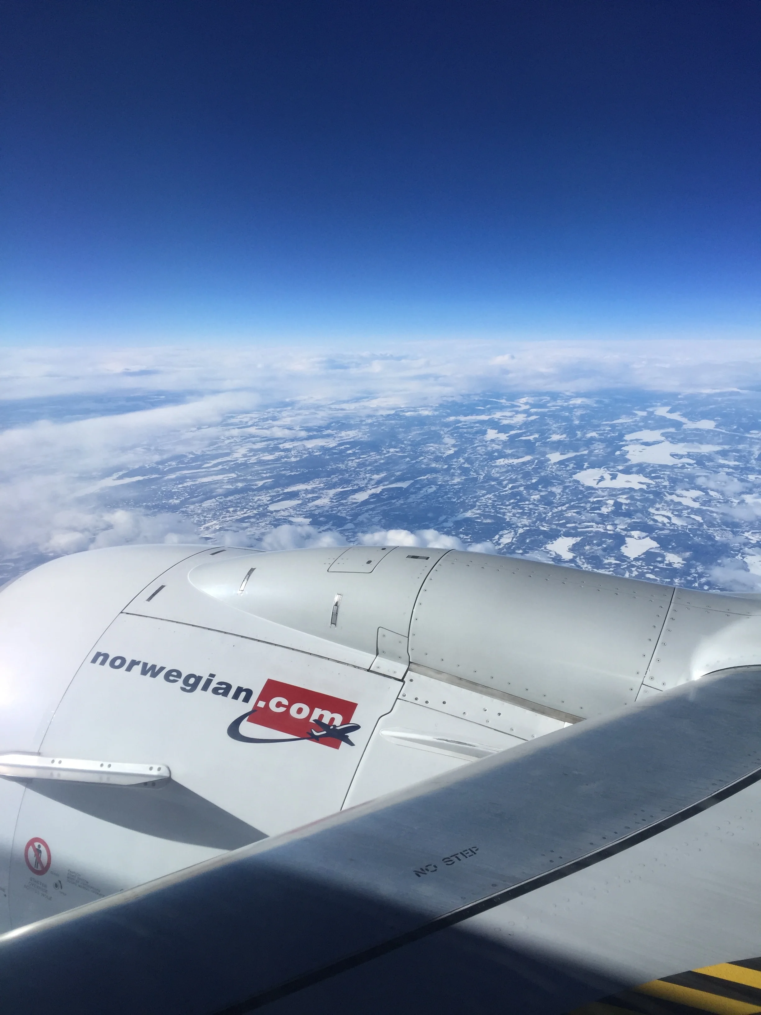 Flying into Norway. "Crossing the boundary between home and adventure."