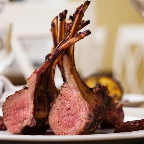 stock-photo-lamb-rack-with-limoncello-glaze-served-on-a-plate-497277970.jpg