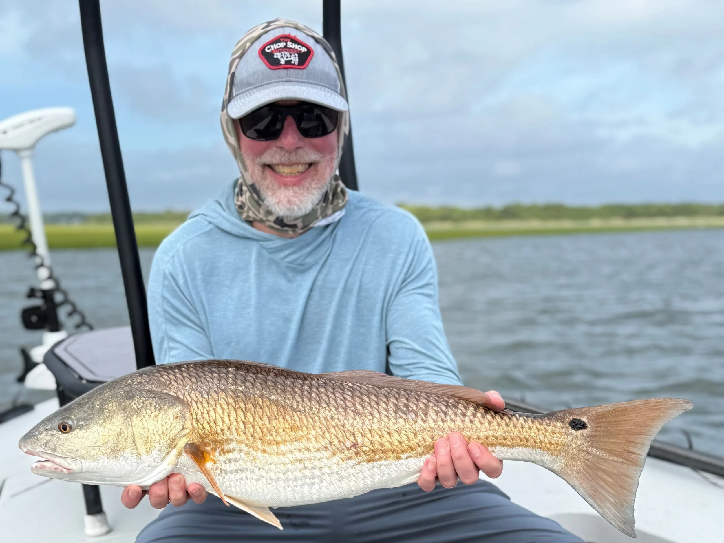 Jim Siemens holds a fish he caught.