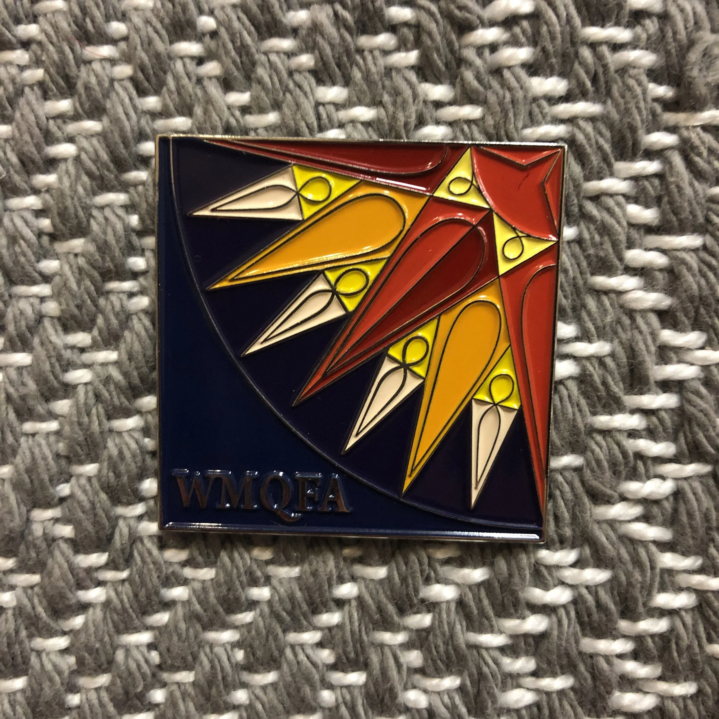 WMQFA initials/orange/yellow