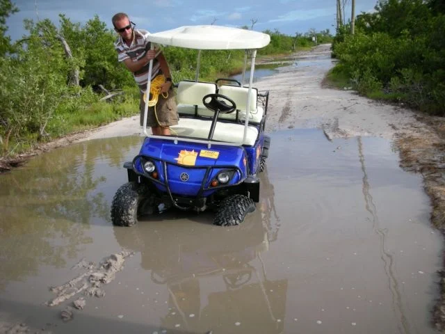 Road north on Ambergris Caye-Nov. 2007. On this day we trekked into town to bring up our first load of wood for the store. We "drove" 4.5 miles into town and Jason kept rope with him so he could pull the cart out when we got stuck. Average time into town: 60-85 minutes each way.