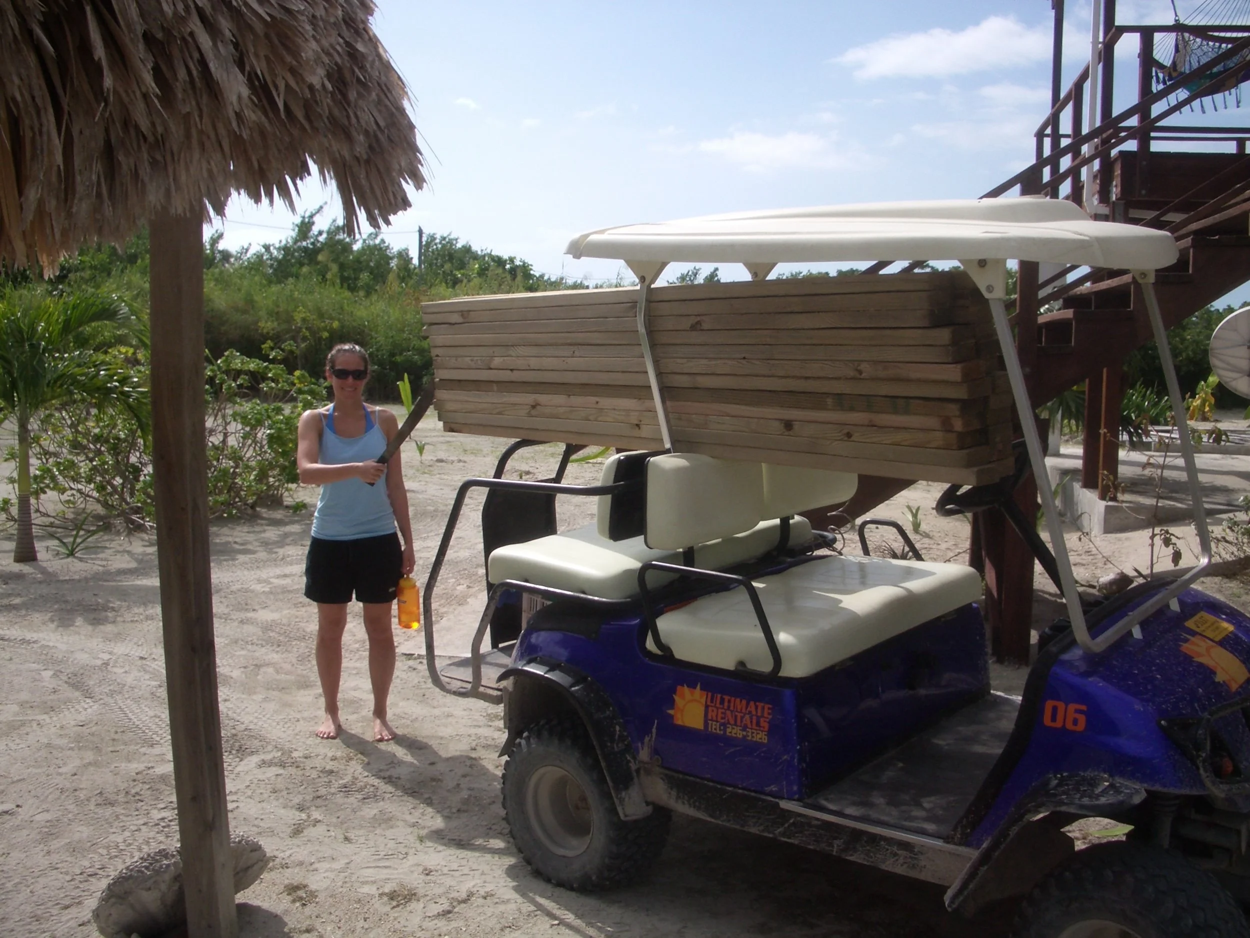 Our first load of wood for the store...we brought up by golf cart. Thus began the construction process.