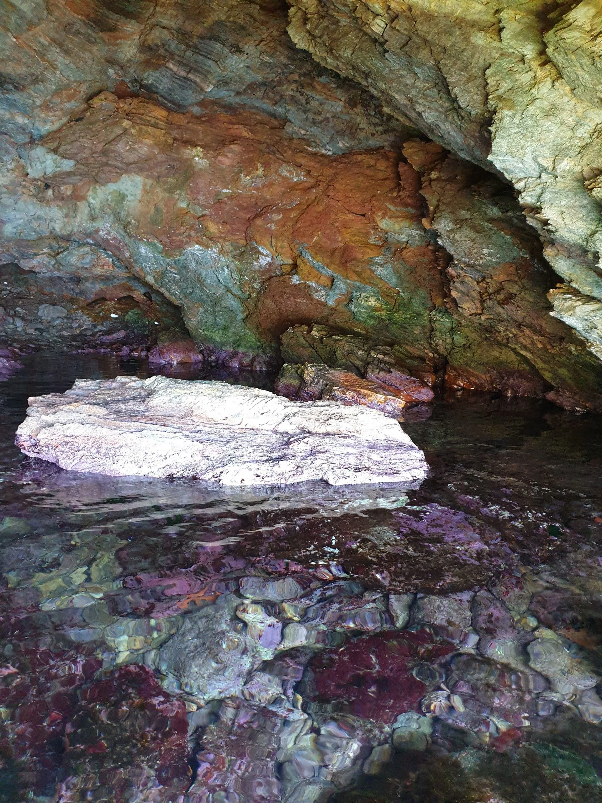 Exploring a cave in Kolones, Kythnos on the SUP.