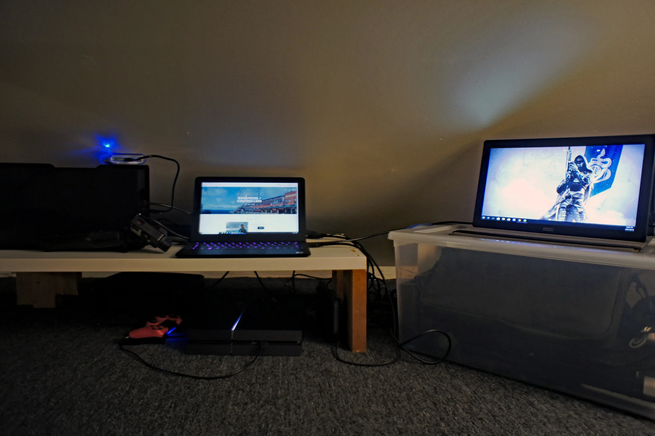 From Left to Right: RazerCore, Razer Blade Stealth, HORI Universal HD Portable Monitor on top of storage container.