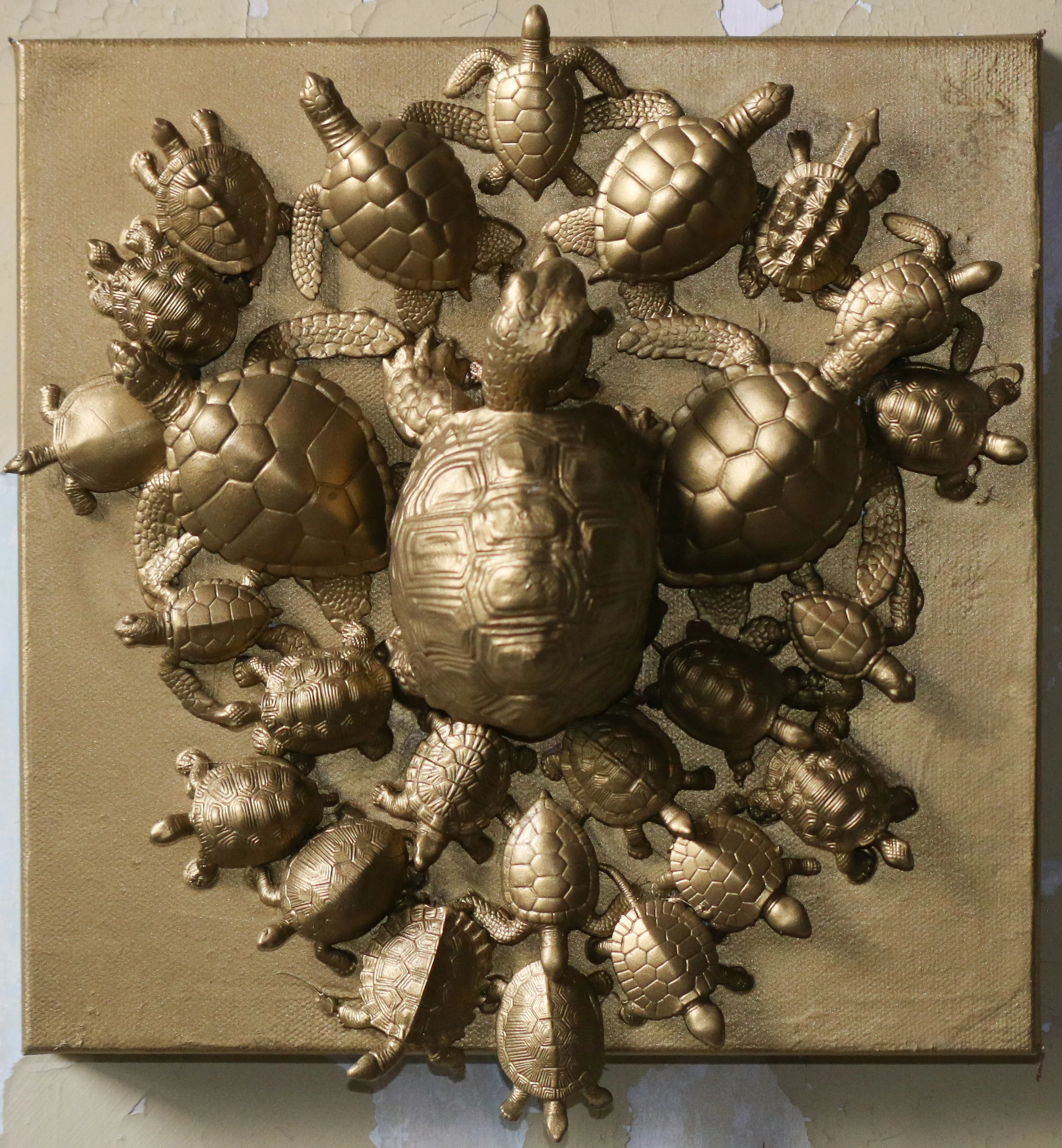 Momma and Her Turtles, 12x12”, turtle sculptures and gold spray paint on canvas, 2019