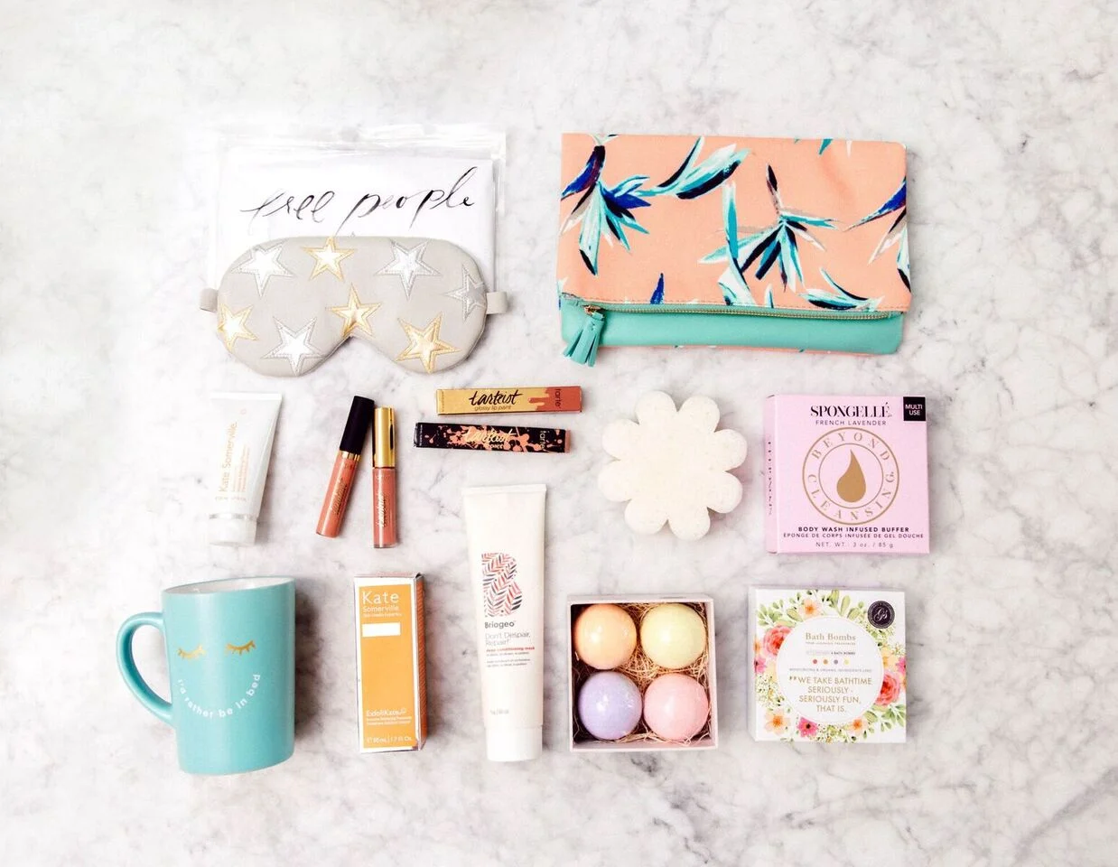 Wellness products from FitFabFun - sleep mask, coffee cup and toiletries.