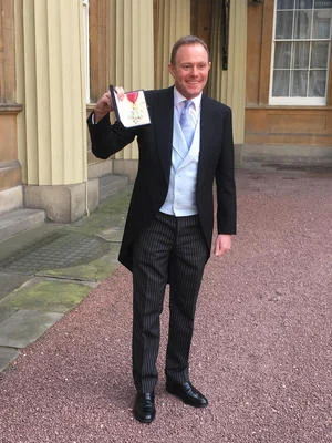 MP receives honour at Buckingham Palace