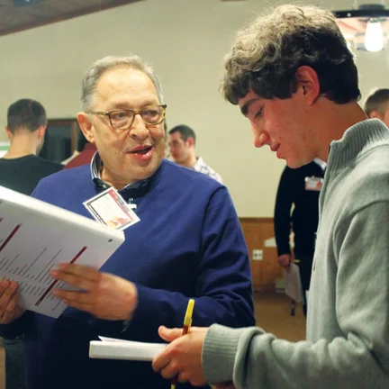 Brother Solvibile (left) working with Collegiate brothers.