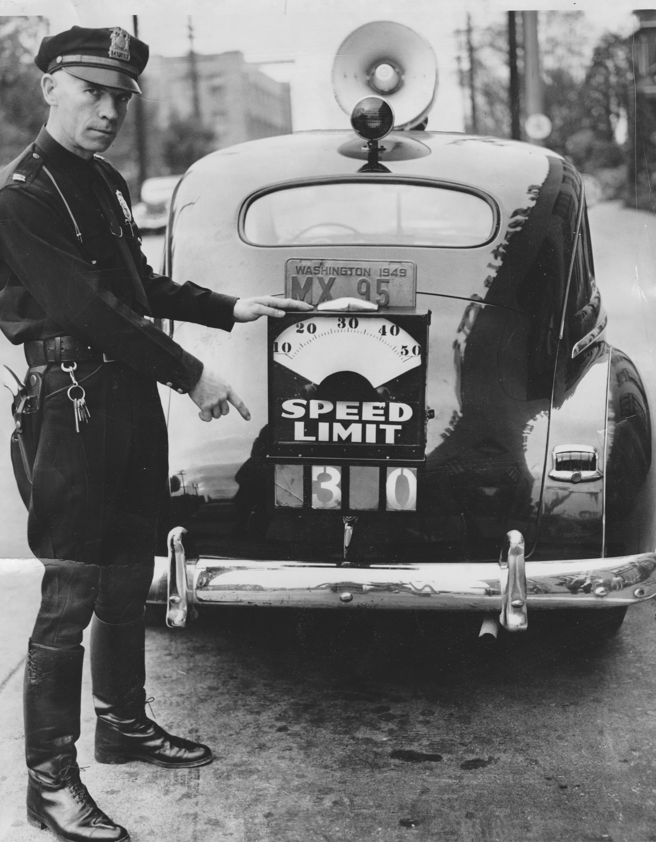 10:30:49-  SPD Capt. Robt. Shaughnessy displays the SPD's newest speed detection device.  Lighted numerals operated from the car's dashboard.  The device was designed and built by Sgt. R. Zottman  SMPM .jpg