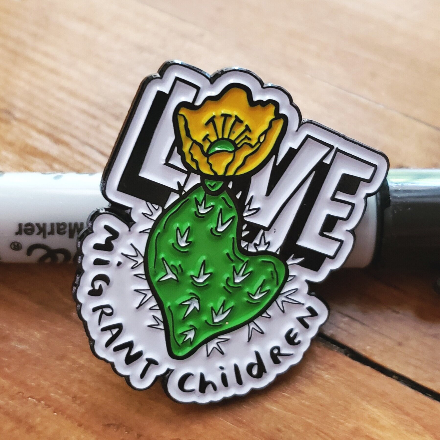Love Migrant Children Enamel Pin