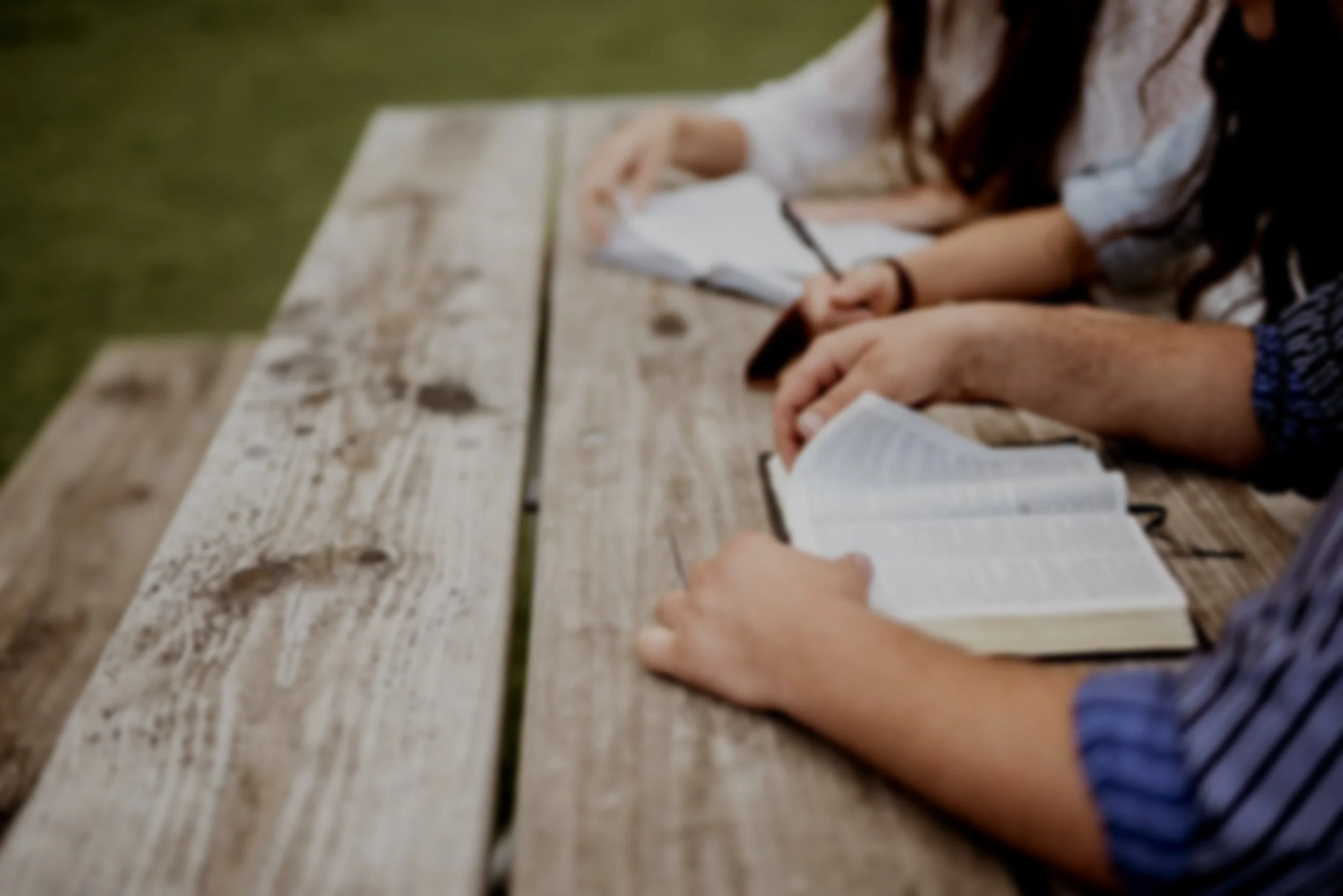 shot-people-sitting-near-each-other-reading-bible.jpg
