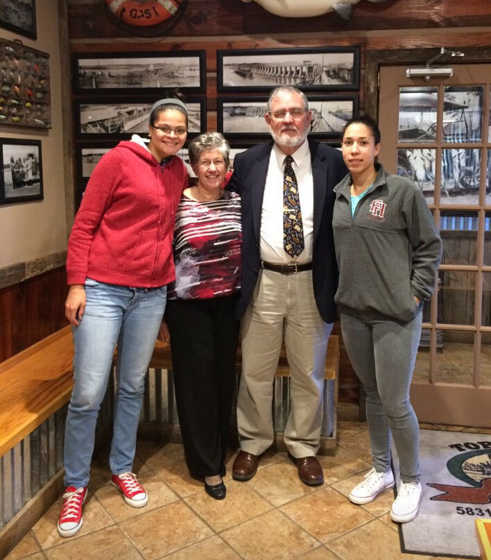 Isis, her best friend Daymari, and Mary Lane and Paul Schwartz, who became close family friends and helped Isis finish her education