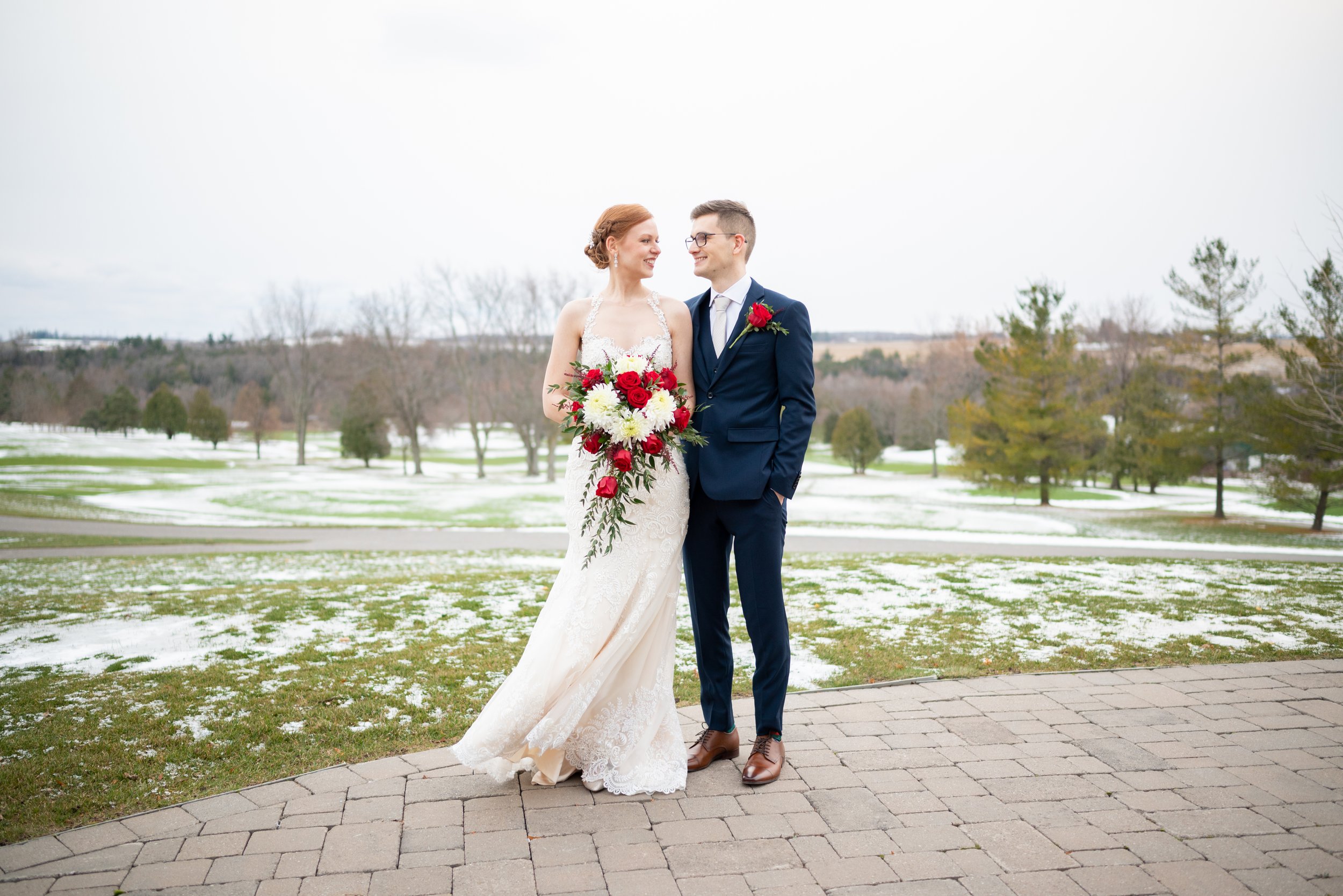 Bride and groom during their winter wedding portraits at Deer Creek in Ajax, Ontario