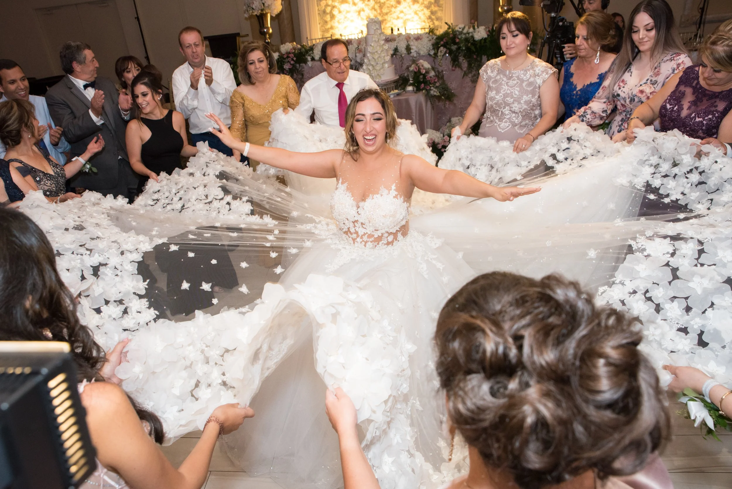 Bride celebrating on the dance floor during her wedding reception at Paradise Banquet Hall in Toronto.