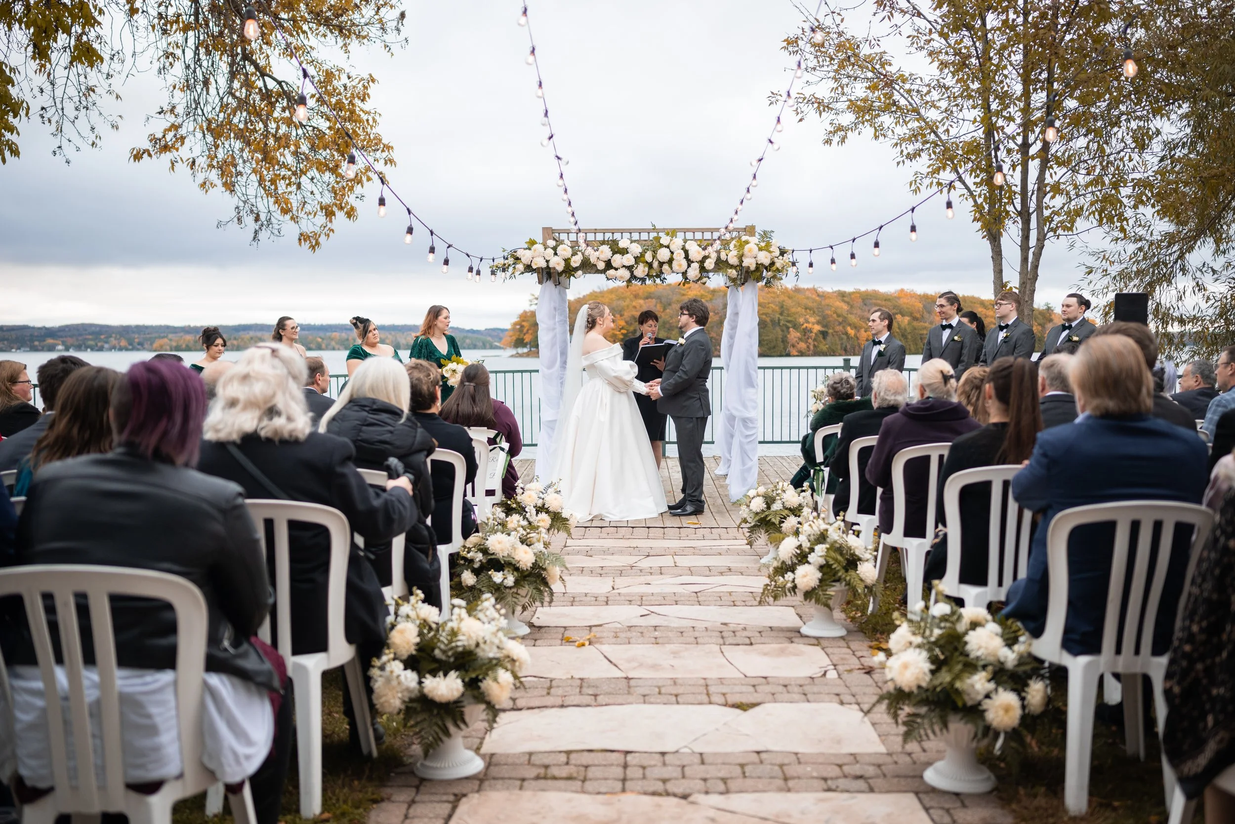 Outdoor waterfront wedding ceremony at Elmhirst’s Resort in Keene, Ontario