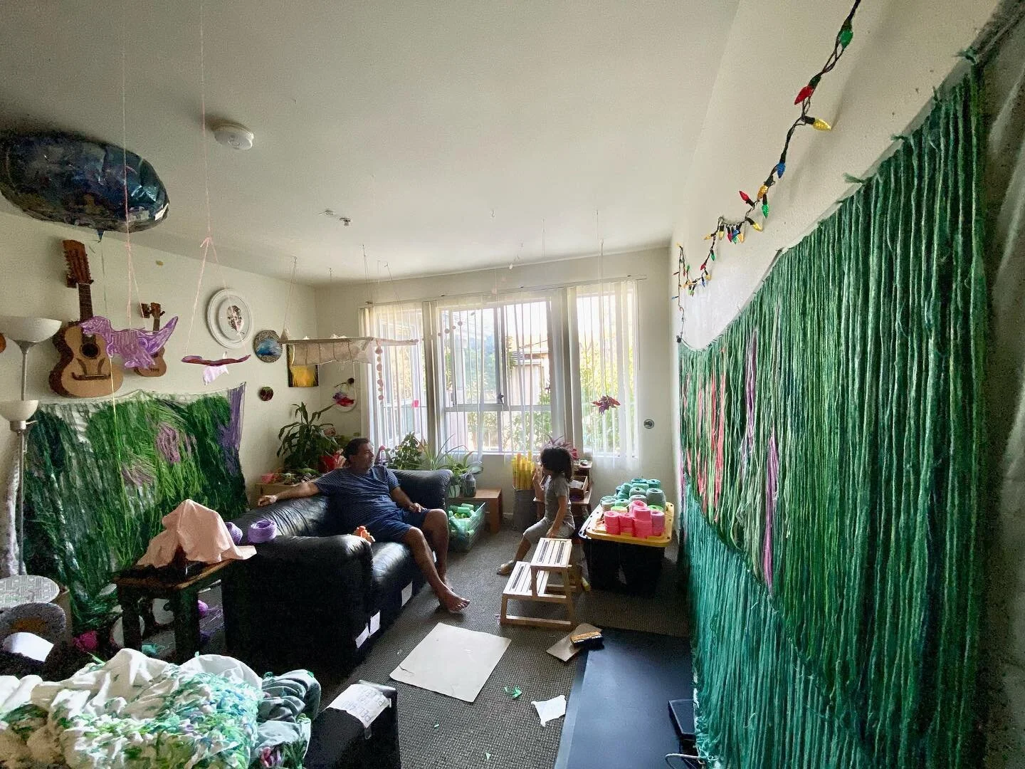 My studio/living room 2 months before my solo show. My soon to be 5yo kid with his abuelo discussing about the pi&ntilde;ata. The pic was taken before 8am. Life is intense.
.

#carmenmardonez #textileart #textileartist #fiberart #fiberartist
#mixedme