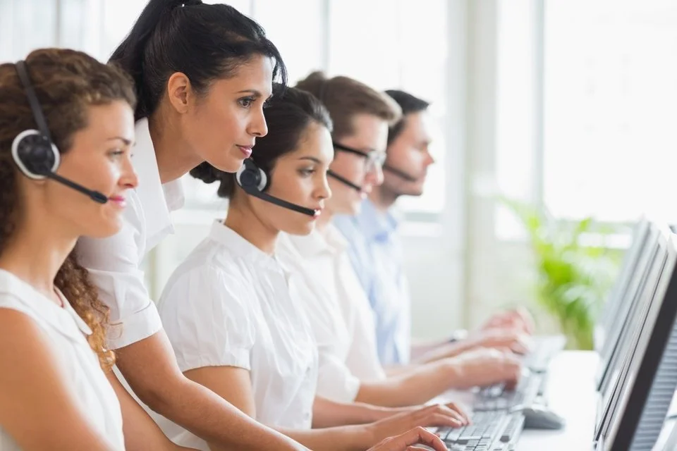 Side view of female manager assisting her staffs in a call center-2.jpeg