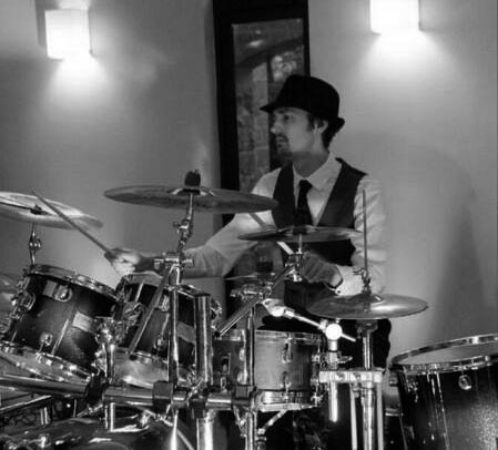 Hewey on the drums at a wedding at Ashorne Hill Warwickshire