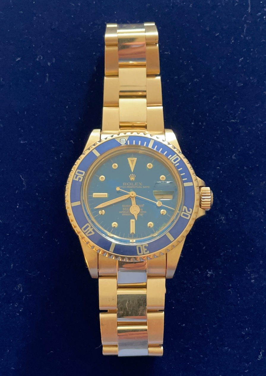 1976 Rolex 18K YG Submariner 1680 Blue Dial and Arabic Date Disk 