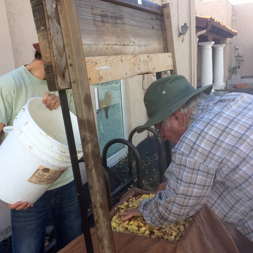 Ward’s DIY rack and cloth apple press travels to harvest festivals around Flagstaff