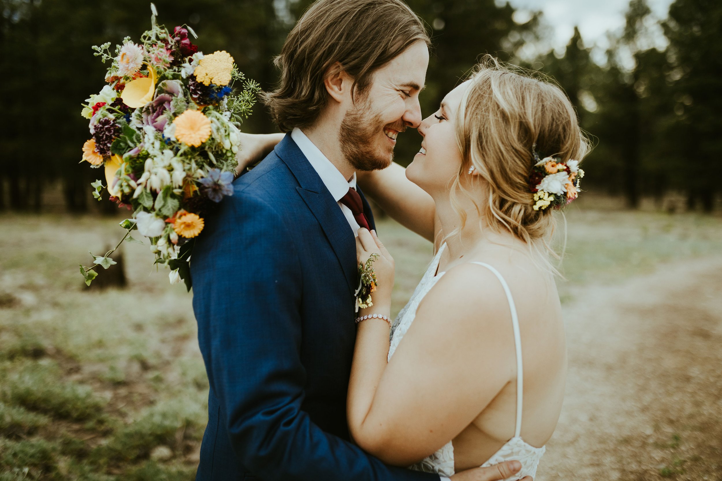 Bold bohemian wildflower wedding couple