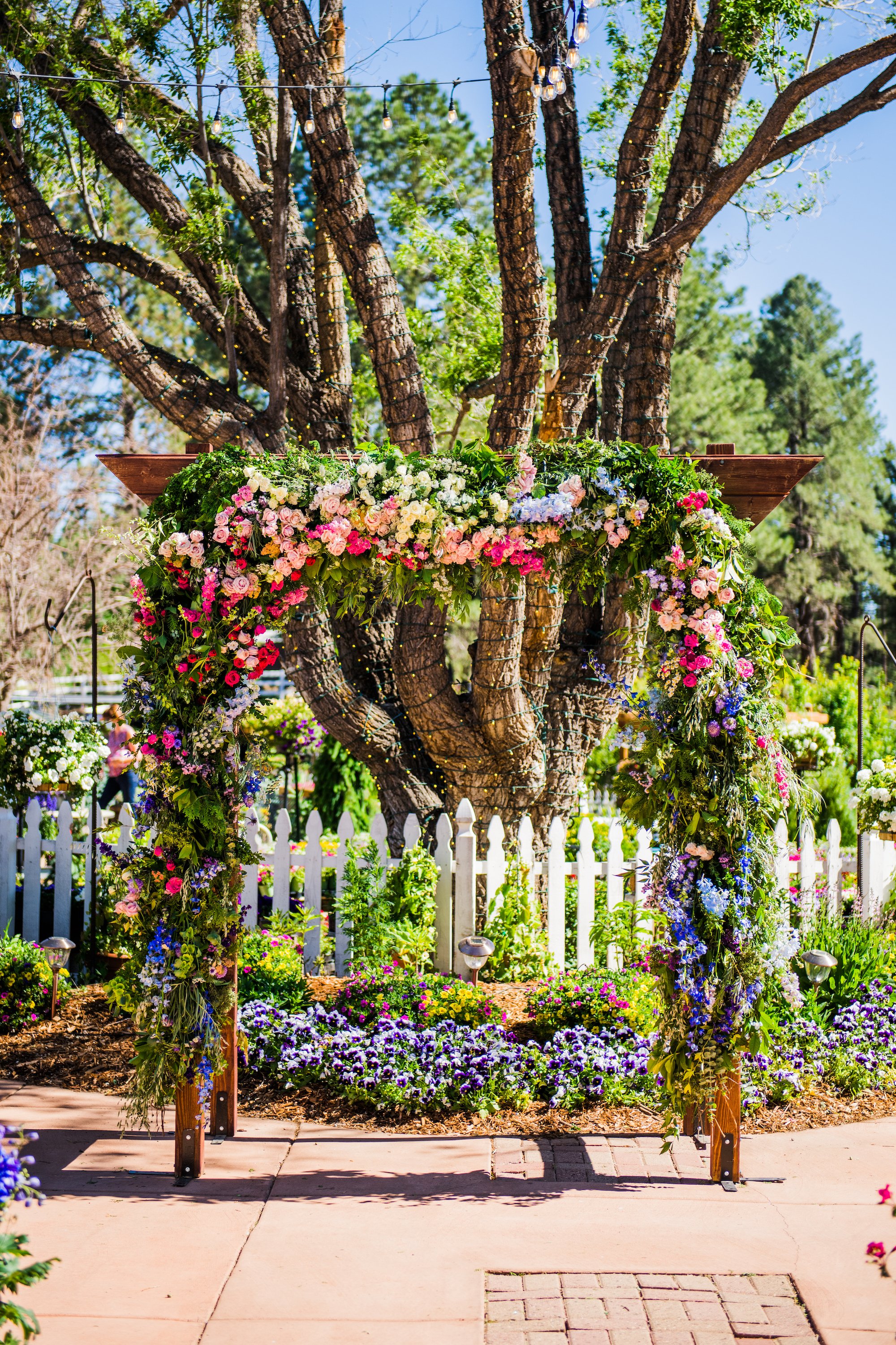 Romantic colorful garden wedding arch