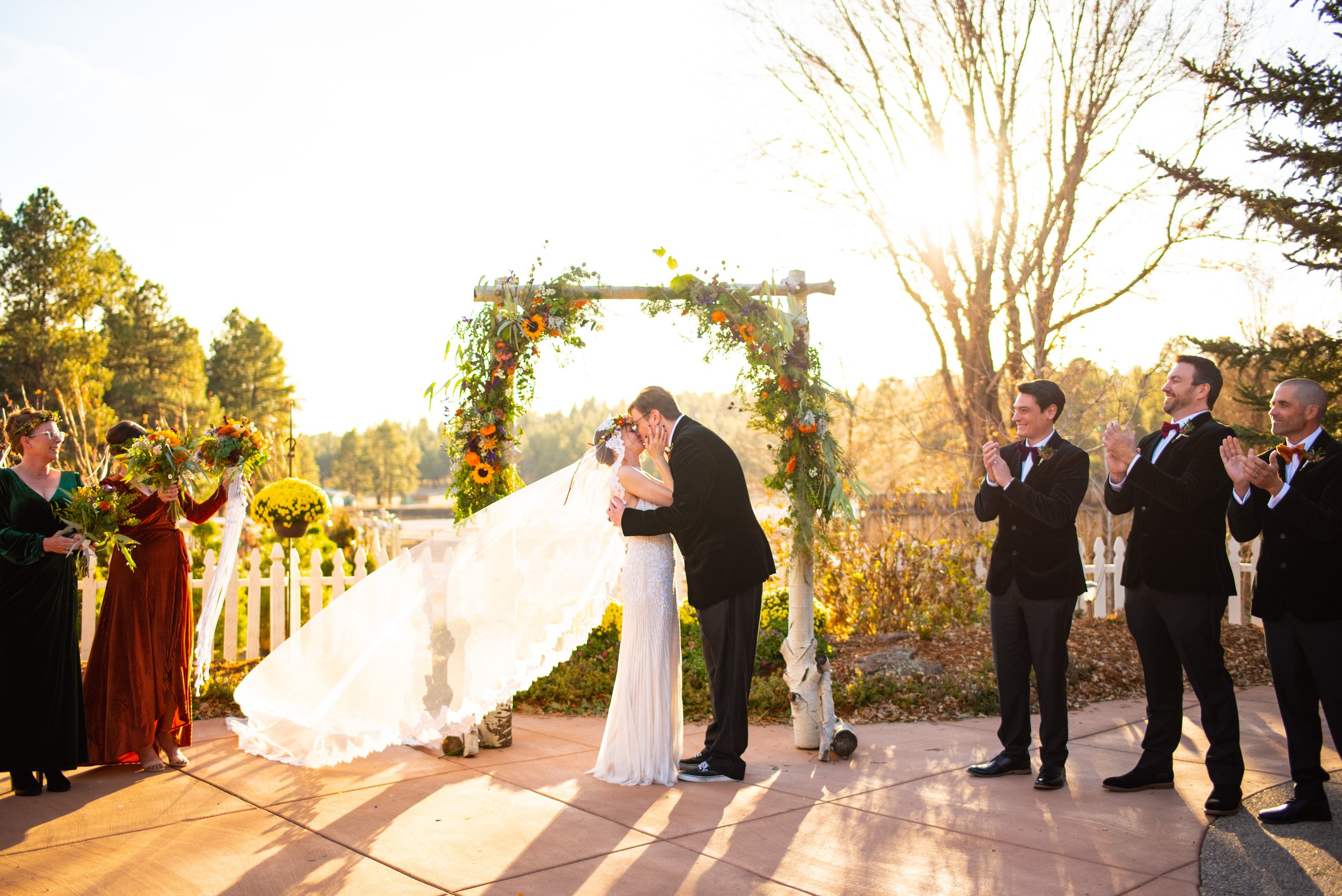 Vibrant autumn fairytale wedding kiss