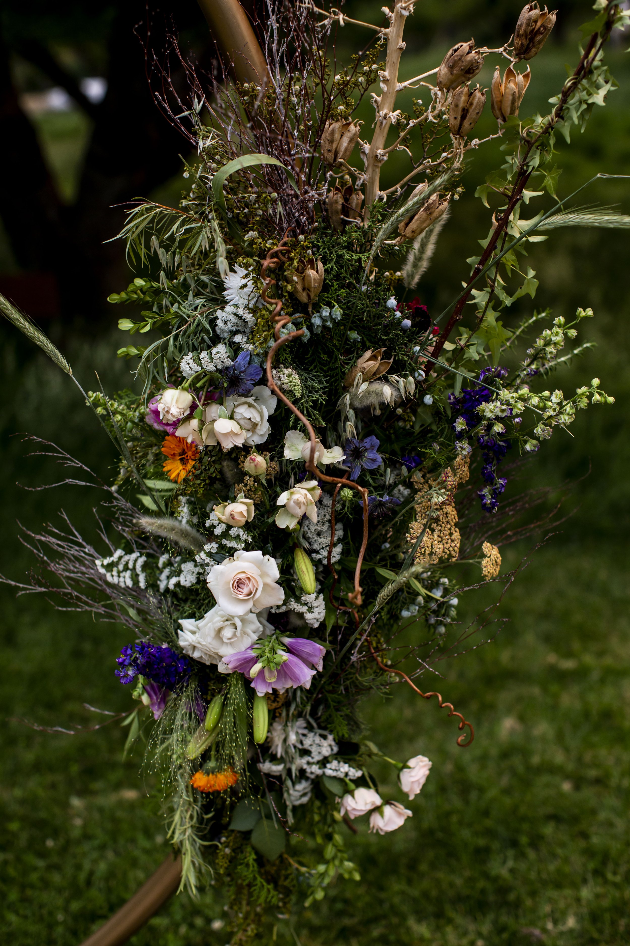 Romantic summer solstice orchard wedding arch detail