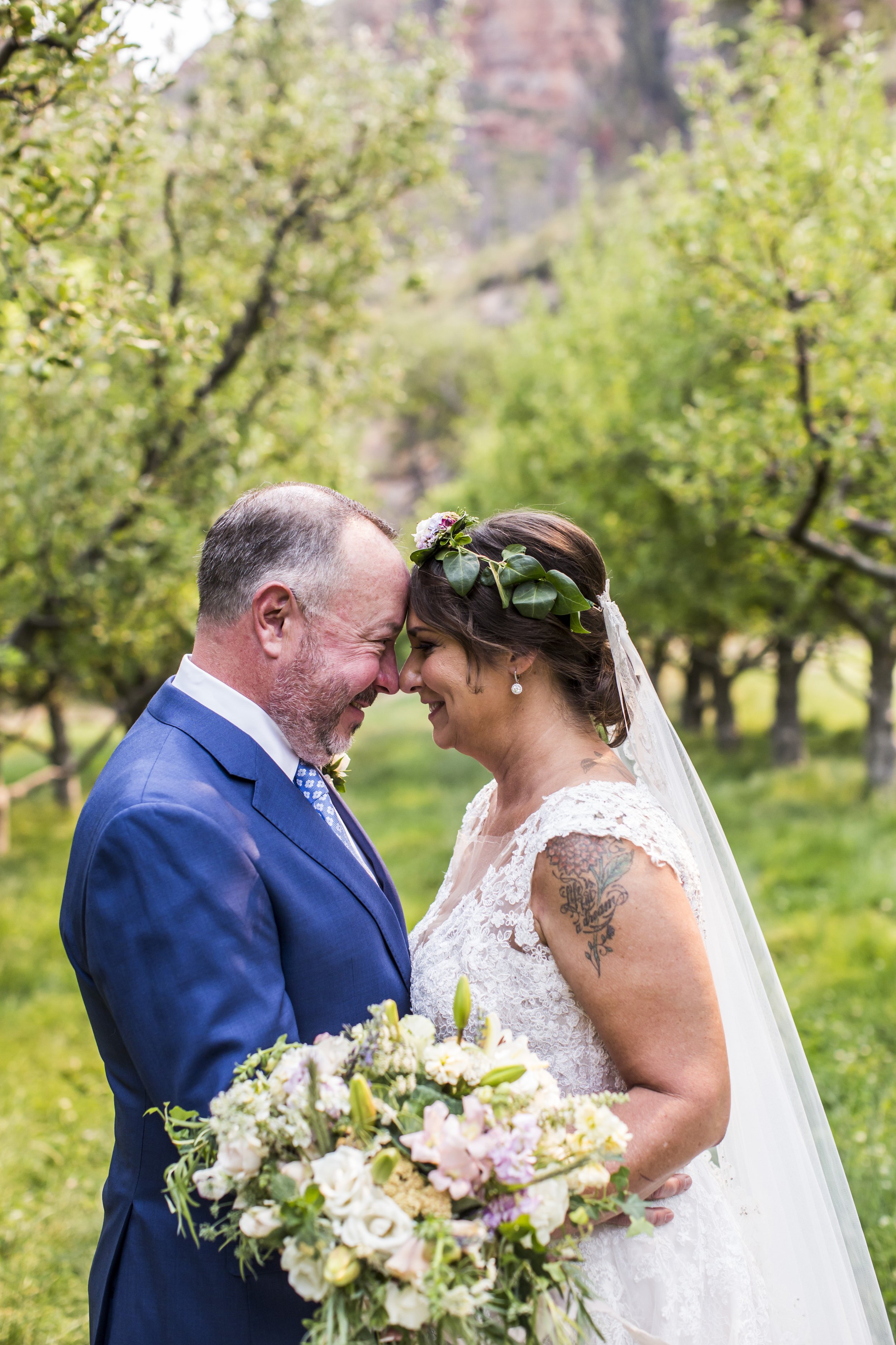 Romantic summer solstice orchard wedding couple