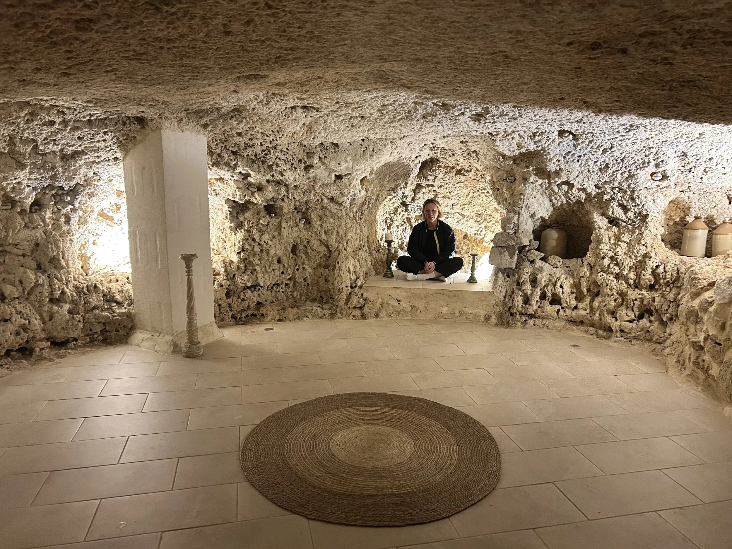 Woman sits in 4,000 year old Heaving Cave