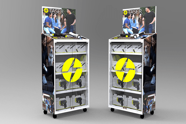 Two display booths showcasing tasers with promotional posters on top, featuring people demonstrating tasers, and the booths have shelves with taser products inside.
