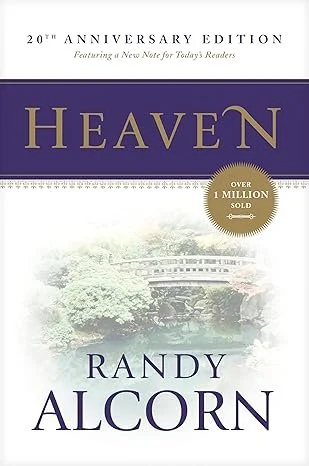 Book cover for Heaven by Randy Alcorn, 20th anniversary edition, featuring a scenic landscape with trees and a bridge.