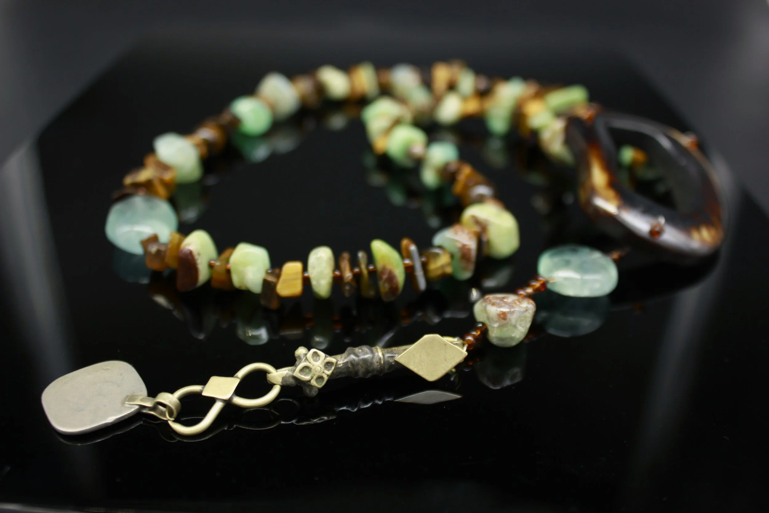 A Funky Tigers eye and Chrysoprase 'Y' necklace with Horn and Antique Afgani pendant 