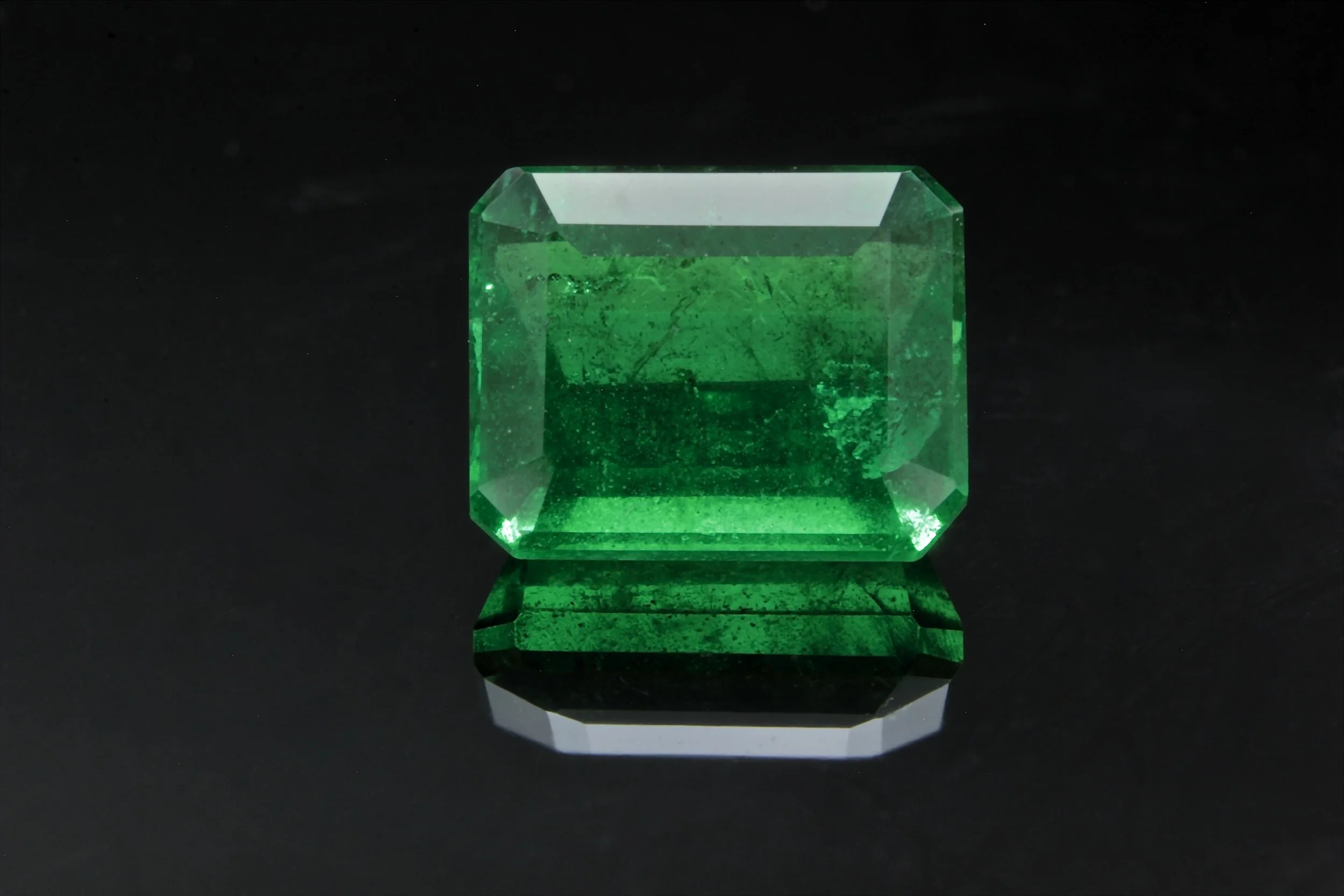 A Natural deep forest green emerald cut Emerald 