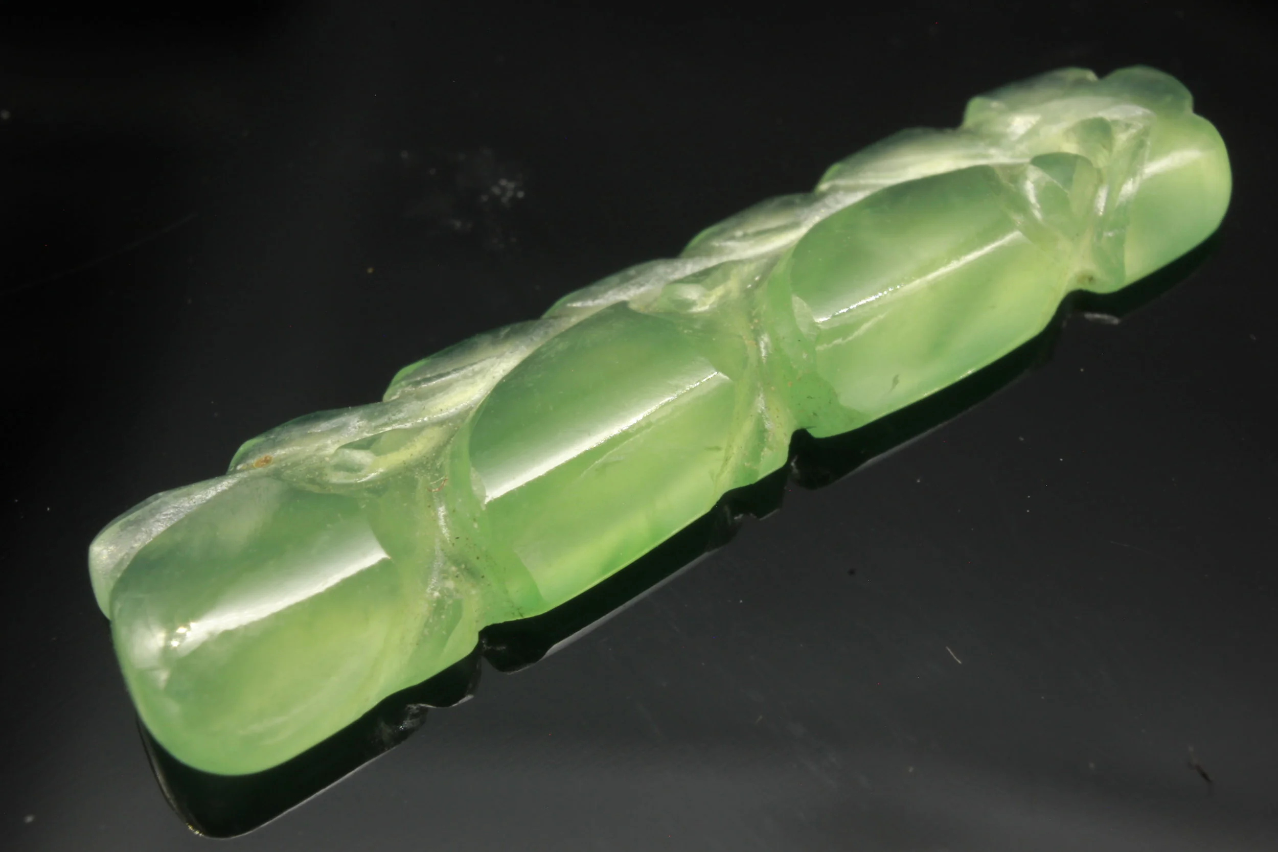 A Translucent Jade Lotus and Phoenix carved Talisman pendant