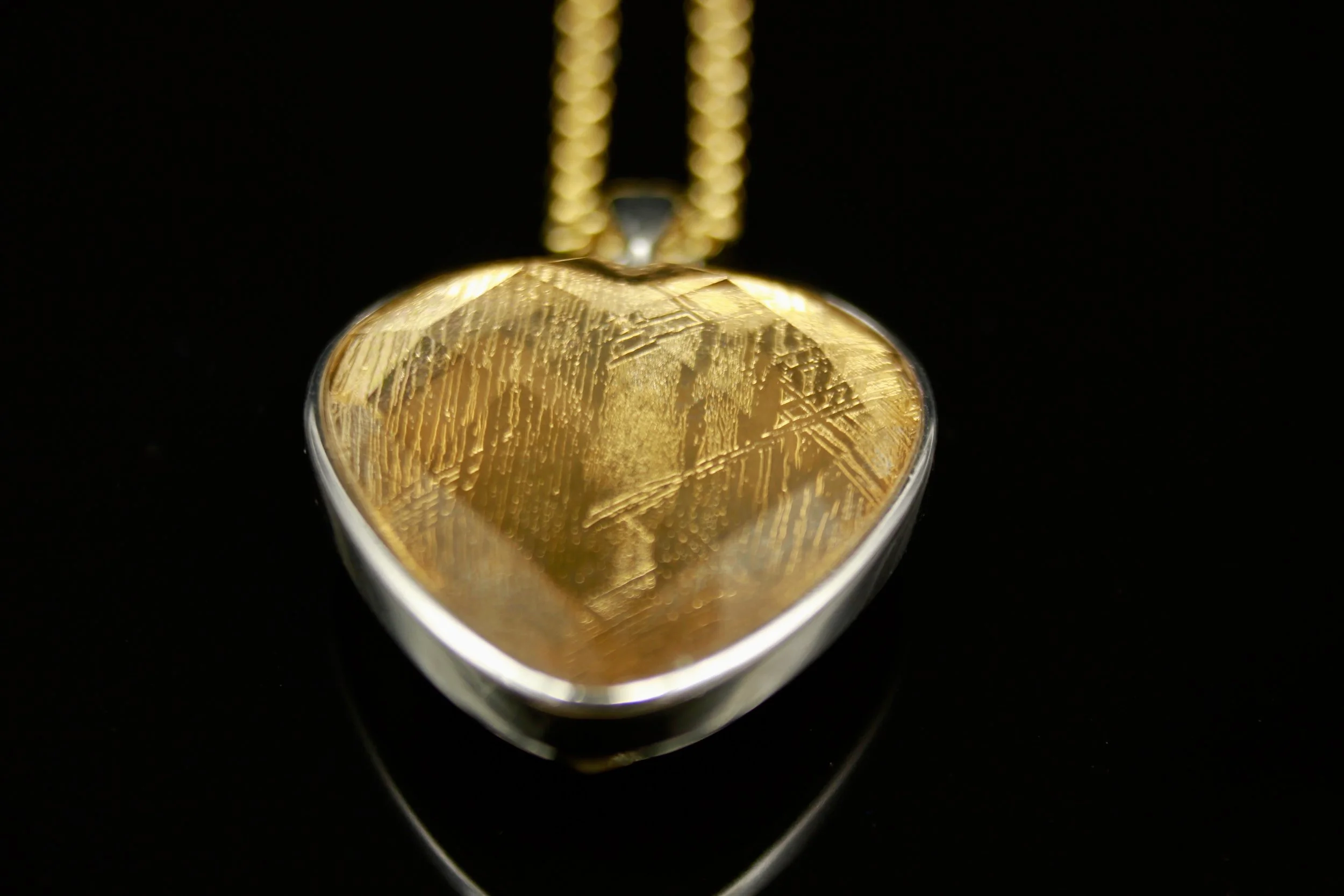 Shooting Star Meteorite coated in 18ct yellow gold incased in crystal (no longer available)