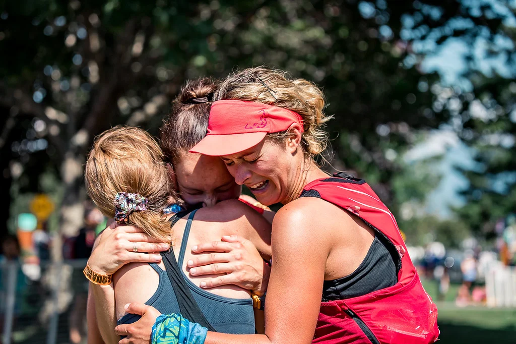 Photo by Hilary Matheson Hugging first place finisher, Tara Holland and right second place finisher Hailey Vandyk.