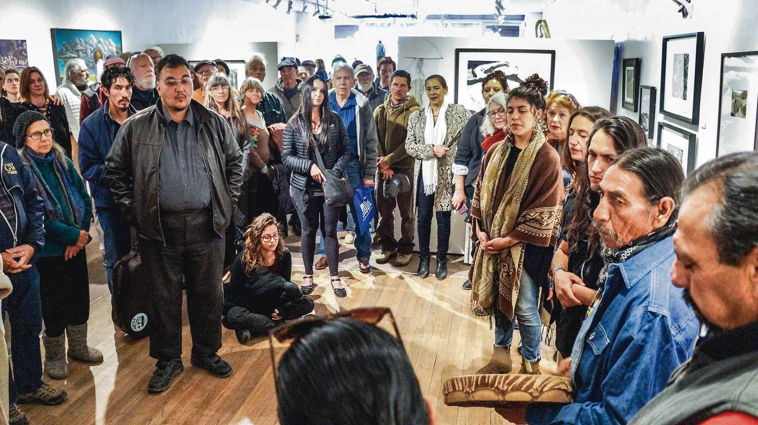 The reception on Saturday (April 13) held a rapt audience of supporters when a group of Native singers did a prayer song honoring the power of water. Photo by Rick Romancito/The Taos News