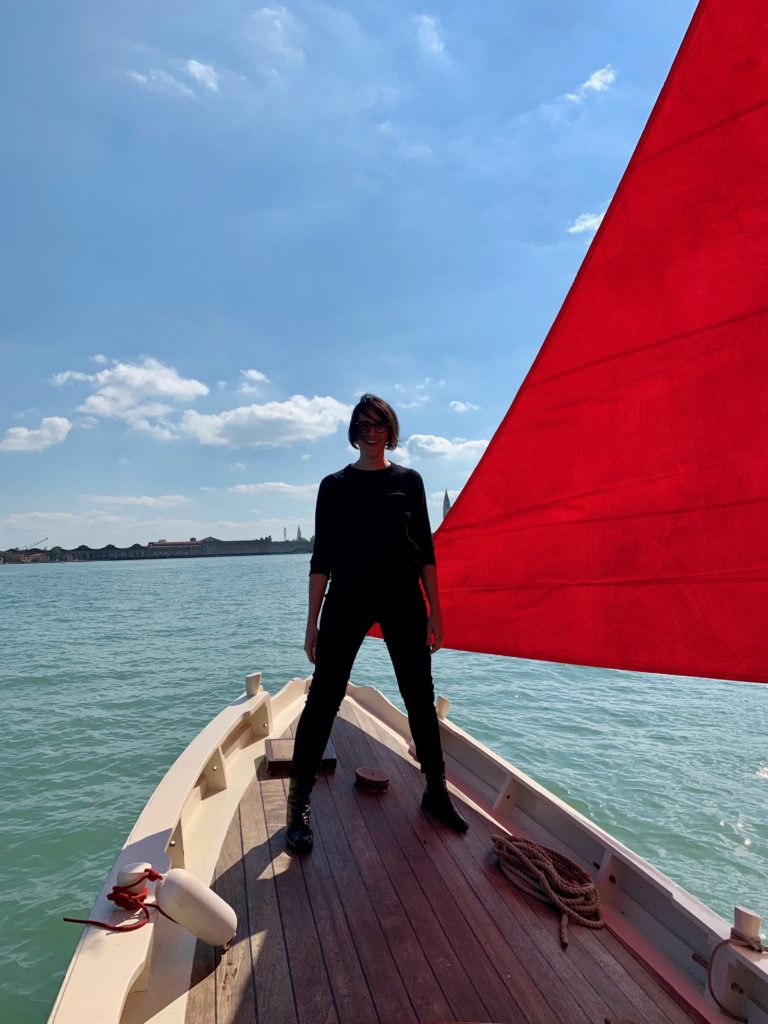 Melissa McGill with one of the boats for her project Red Regatta . Photo by Sarah Cascone.