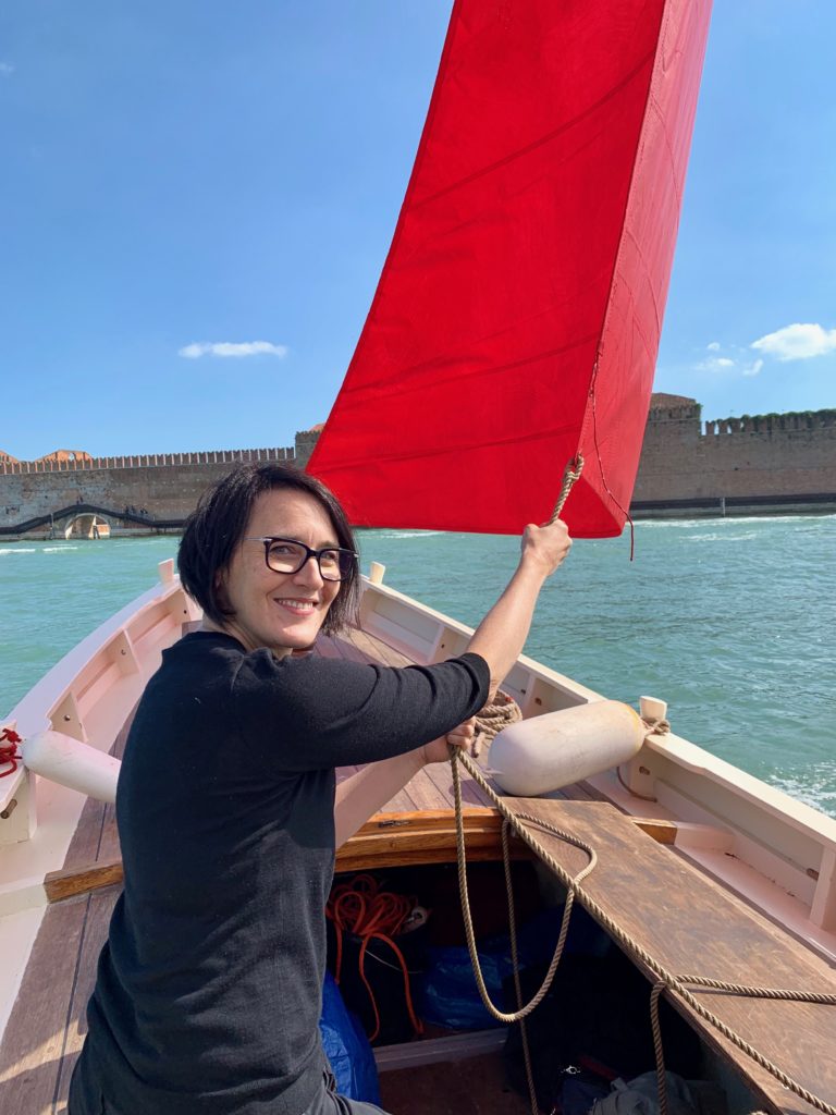 Melissa McGill with one of the boats for her project Red Regatta . Photo by Sarah Cascone.