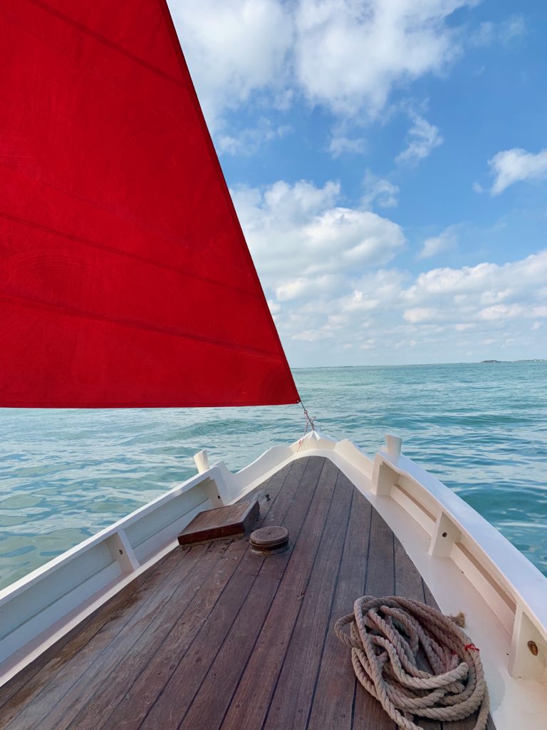 Melissa McGill with one of the boats for her project Red Regatta . Photo by Sarah Cascone.