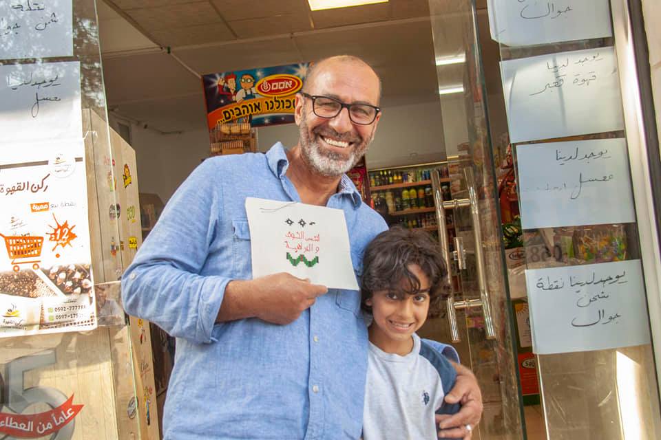  Nasser with his son, owner of Ziad grocery store and resident of the camp, Dheisheh Refugee Camp, Bethlehem, Palestine 