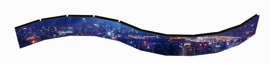 A panoramic curved digital cityscape showing a vibrant nighttime city with tall buildings, bright lights, and a starry sky