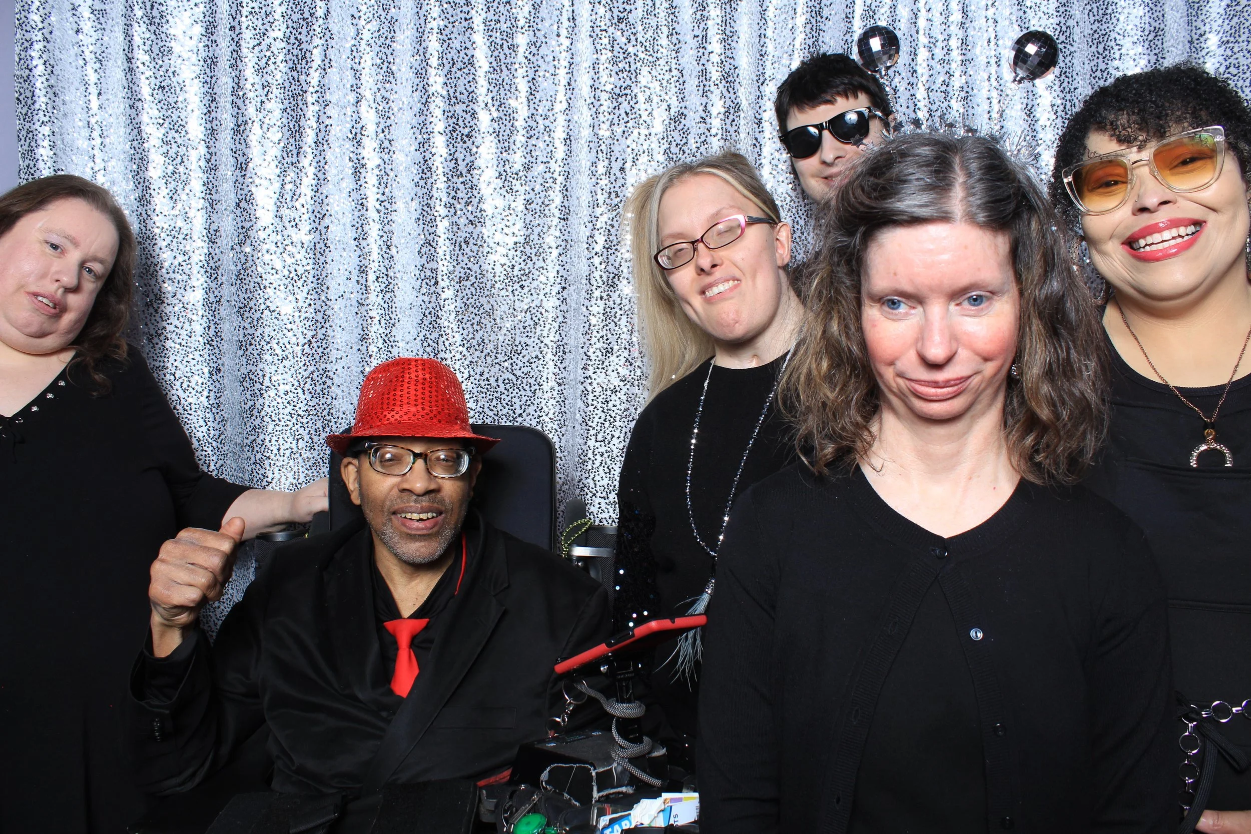 A series of playful photo booth images featuring PHAME community members posing together with reflective backdrops and props.