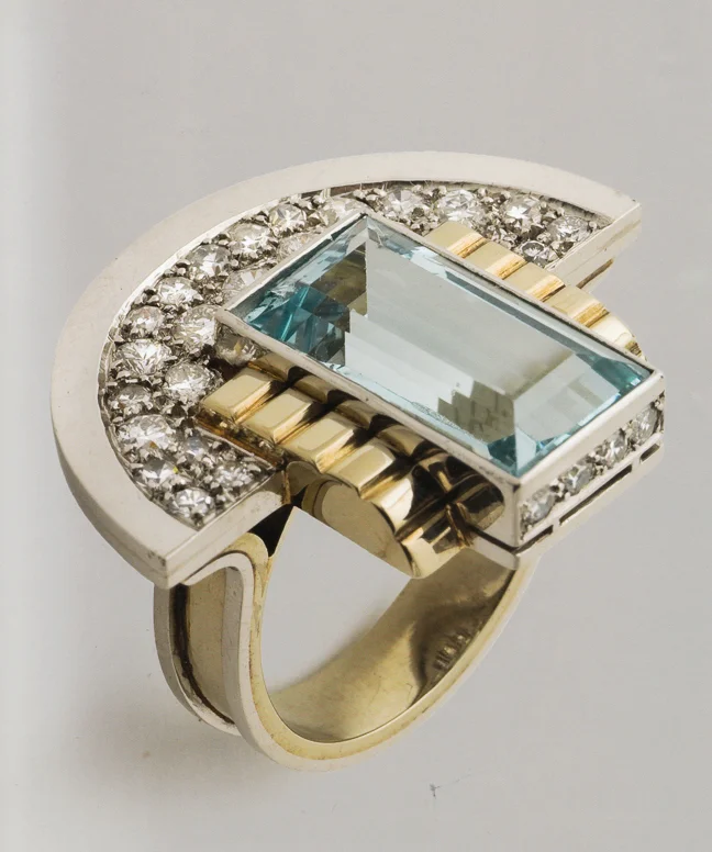 Art Deco Jewelry: ring designed circa 1930's by Jean Després. Despres was a French jewelry maker and designer best known for his intricate Art Deco jewelry made from semi-precious stones, machine parts, and enamel. His jewelry is the perfect mix of the luxury and machinery aesthetic. 