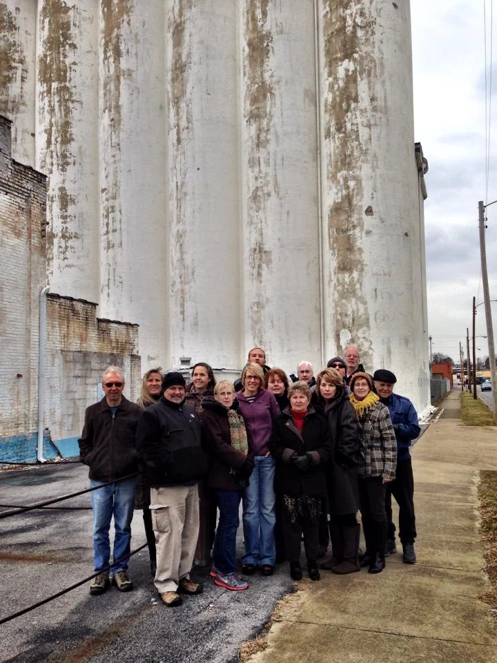 Jodi (center, in purple) with other activists in front of the Model Mill.