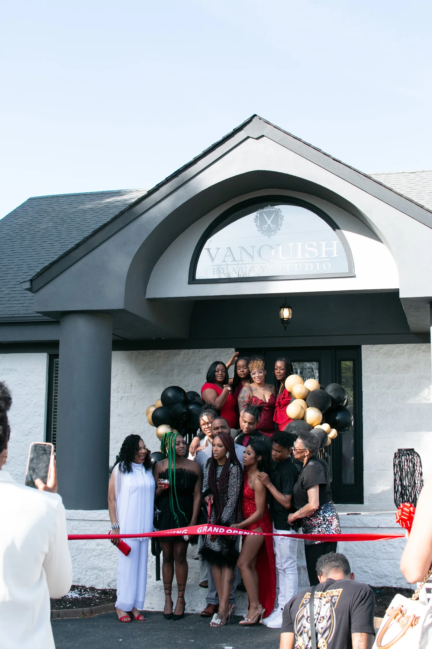 Vanquish Beauty Studio team at the grand reopening ribbon cutting